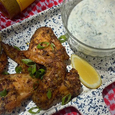 Plate of Chicken Wings with a bowl of Labneh Sauce