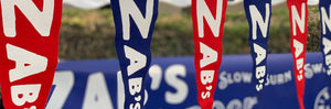 Pennant Flags hanging that say "Zab's"