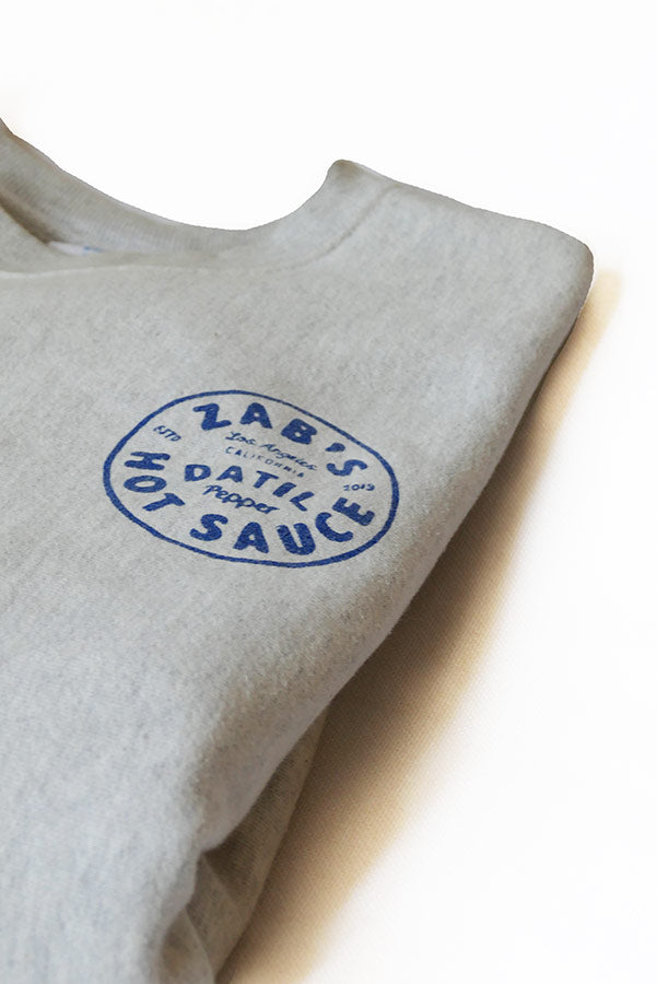 Folded Crew Neck Sweatshirt with Zab’s hot sauce logo in  blue