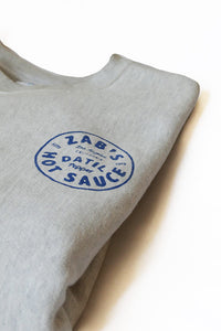 Folded Crew Neck Sweatshirt with Zab’s hot sauce logo in  blue
